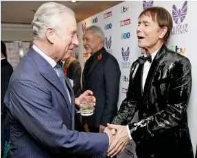  ??  ?? Back on the red carpet: Prince Charles with Cliff Richard last night