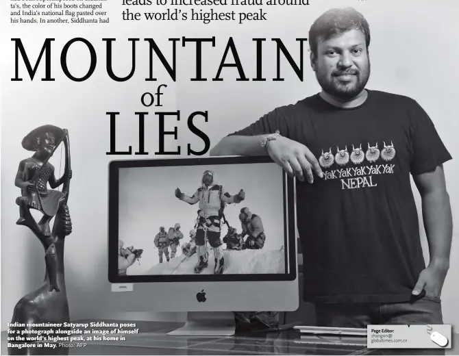  ?? Photo: AFP ?? Indian mountainee­r Satyarup Siddhanta poses for a photograph alongside an image of himself on the world’s highest peak, at his home in Bangalore in May.