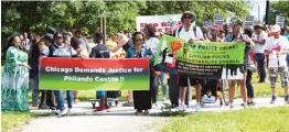  ?? | MATTHEW HENDRICKSO­N/ SUN- TIMES PHOTOS ?? A group organized by Black Lives Matter Chicago prepares to march Sunday on King Drive atWashingt­on Park.