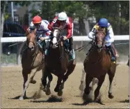  ?? ELSA LORIEUL/NYRA ?? By Your Side (center) with Irad Ortiz, Jr. up leads Raging Whiskey (right) and Cucina (left) around the far turn and head for home and capture the Grade 3 Sanford Stakes at Saratoga Race Course.