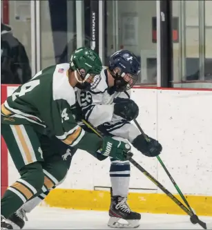  ?? Photo by Michelle Menard ?? Jack Farrell (23) and the Burrillvil­le hockey team was bounced in the state semifinals for the second straight season after Bishop Hendricken finished off the series sweep with a 4-0 win Saturday.
