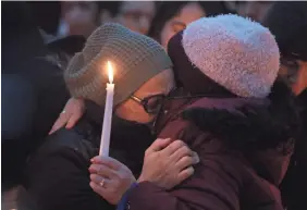  ?? PETER CARR/USA TODAY NETWORK ?? Norma Sanchez, left, at a vigil Thursday for her daughter Valerie Reyes in New Rochelle, N.Y. Reyes’ body was identified Thursday.