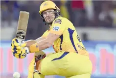  ?? — AFP photo ?? In this file photo taken on May 12, 2019 Chennai Super Kings cricketer Shane Watson (L) plays a shot -- with blood staining his uniform behind his pads on his left knee -- during the 2019 Indian Premier League (IPL) Twenty20 final cricket match between Mumbai Indians and Chennai Super Kings at the Rajiv Gandhi Internatio­nal Cricket Stadium in Hyderabad.