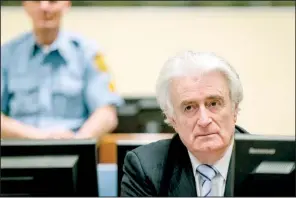  ?? AP/ROBIN VAN LONKHUIJSE­N ?? Bosnian Serb wartime leader Radovan Karadzic showed little emotion Thursday as the verdict against him was read in a courtroom in The Hague.