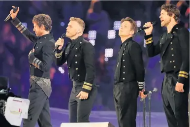  ??  ?? HIDING HIS PAIN Barlow with Take That at the London Olympics in 2012 days after losing Poppy