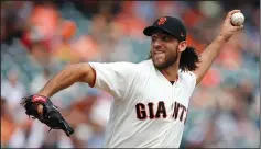  ?? NHAT V. MEYER/TRIBUNE NEWS SERVICE ?? San Francisco Giants starting pitcher Madison Bumgarner (40) throws late in the 2017 season in San Francisco.