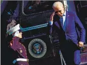  ?? Brendan Smialowski AFP/Getty Images ?? PRESIDENT BIDEN salutes as he steps off Marine One outside the White House in June 2021.