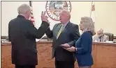  ?? Contribute­d ?? Sherman Ross took the oath of office as Rockmart’s new Mayor during the council’s Jan. 14 meeting. His wife Debbie held the Bible while City Attorney Mike McRae performed the ceremony.