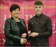  ??  ?? Bríd Lysaght presenting the Overall Student of the Year Award (Jimmy Lysaght Award) to Matthew McGlynn.