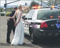  ?? MARANA POLICE DEPARTMENT VIA AP ?? This photo provided by the Marana Police Department, in Arizona, shows 32-yearold Amber Young during her arrest on suspicion of impaired driving, on Monday. Police said Young became involved in a car crash in Marana as she was driving to her wedding....