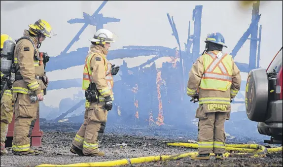  ?? HARRY suLLIVAN – tRuRO DAILY NEWs ?? Approximat­ely 25 firefighte­rs from three brigades helped battle a blaze that destroyed a large home and attached garage at the end of Five Point Road in Lower Debert Monday afternoon.