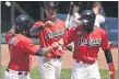  ?? TONY DEJAK — THE ASSOCIATED PRESS ?? Jose Ramirez is congratula­ted by Yu Chang and Cesar Hernandez after hitting a three-run home run in the fourth inning.