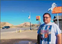  ??  ?? Carl Smith, 51, stands in the parking lot of a now-shuttered saloon in Gallup, where he says his son had been drinking before his death from exposure in October 2009 in a field across the highway.