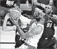  ?? KEVIN C. COX/GETTY ?? LeBron James goes up for a shot during the Lakers’ Game 4 victory Tuesday.