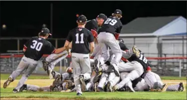  ?? AUSTIN HERTZOG - DIGITAL FIRST MEDIA ?? The Boyertown baseball team piles on to one another after winning the PAC championsh­ip with a 7-0 victory over Phoenixvil­le Friday.