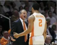  ?? JOY KIMBROUGH — THE DAILY TIMES VIA AP ?? Tennessee head coach Rick Barnes talks to forward Grant Williams (2) as he comes out of the game during the second half of an NCAA college basketball game against Florida, Saturday in Knoxville, Tenn.
