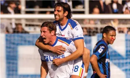  ?? ?? Federico Baschirott­o and Pietro Ceccaroni celebrate the win over Atalanta Photograph: Mairo Cinquetti/NurPhoto/Shuttersto­ck