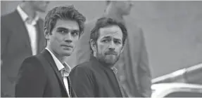  ?? DIYAH PERA/CW ?? Archie (KJ Apa, left) and father Fred (Luke Perry) in CW’s “Riverdale.”