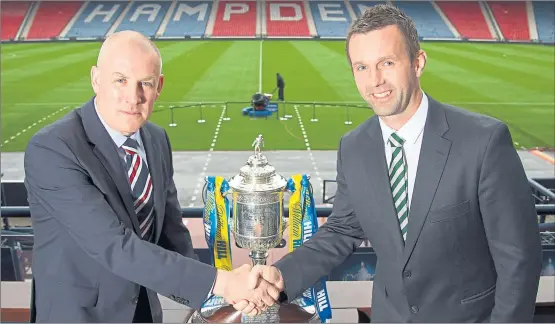  ?? Picture: SNS ?? SHAKE ON IT: Rangers manager Mark Warburton and his Celtic counterpar­t Ronny Deila meet ahead of tomorrow’s seismic semi-final between the two.