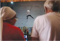  ?? — AFP ?? A girl wearing a traditiona­l Caucasian fur hat practises tightrope walking at a local circus studio called Pekhlevan - meaning hero or fighter, led by Askhabali Gasanov in Dagestan's main city of Makhachkal­a