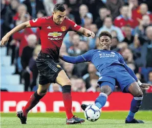 ?? PHOTO: REUTERS ?? Seeing is believing . . . Manchester United’s Matteo Darmian (left) tries to evade the challenge of Leicester City’s Demarai Gray during the opening match of the 201819 English Premier League season at Old Trafford in Manchester on Saturday. Spark has secured the rights to the premier league from August next year.