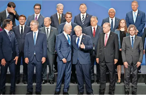  ?? STEFAN ROUSSEAU / PA ?? Prime Minister Boris Johnson with US President Joe Biden, centre, and other Nato leaders at yesterday’s summit in Madrid, Spain