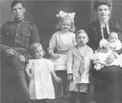  ?? PHOTO COURTESY ROBERT NIELSEN ?? George Thomas Giles with his wife and children in an undated family photo. Reading his grandfathe­r George’s letters home helped author Robert Nielsen get a picture of his grandfathe­r’s life, and death, during the First World War.