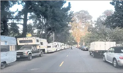  ?? JOHN ORR — STAFF ARCHIVES ?? Recreation­al vehicles and other trucks and cars are lined up the entire length of Crisanto Avenue along Rengstorff Park in Mountain View. RVs have become an increasing choice for the working poor as rents and mortgages have skyrockete­d over the past few years.