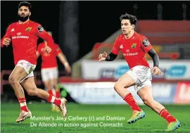  ??  ?? Munster’s Joey Carbery (r) and Damian De Allende in action against Connacht