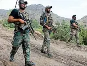  ?? GHULAMULLA­H HABIBI/EPA ?? Afghan soldiers patrol near where two U.S. service members were killed in operations against Islamic State.