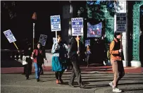  ?? TERRY CHEA/ASSOCIATED PRESS ?? Graduate student instructor­s and researcher­s picket Wednesday at University of California, Berkeley’s Sather Gate during the fourth week of a strike by academic workers at the 10-campus UC system in Berkeley, Calif.