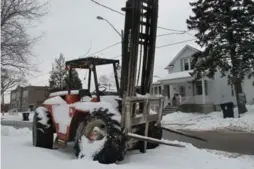  ?? JACK LAKEY/TORONTO STAR ?? A broken-down forklift with the front wheels falling off has languished in a parking spot on Daisy Ave. for nearly two months, annoying local residents.