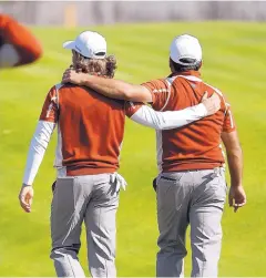  ?? ALASTAIR GRANT/ASSOCIATED PRESS ?? Europe’s Tommy Fleetwood, left, and Francesco Molinari walk away after beating Tiger Woods and Patrick Reed of the U.S. 4 and 3.