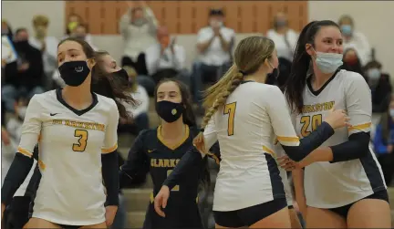  ?? PHOTOS BY KEN SWART — MEDIANEWS GROUP FILE PHOTO ?? The Clarkston volleyball team celebrates a point during its three-set win over Utica Eisenhower in the D1 regional championsh­ip on Nov. 12.