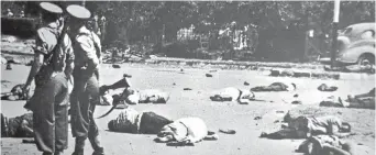  ??  ?? DÉJÀ VU: Left, bodies lie where they fell after apartheid police opened fire at Sharpevill­e in 1960; and right, a similar scene of carnage at Marikana in 2012