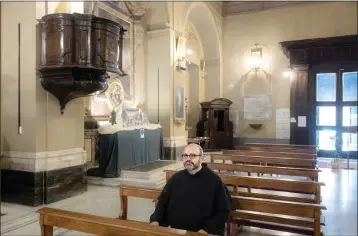  ?? PHOTOS BY ALESSANDRO PENSO — THE NEW YORK TIMES ?? Paolo Benanti, a Franciscan friar and a professor at the Gregorian, the Harvard of Rome's pontifical universiti­es, in the Church of Saints Quirico and Giulitta in Rome on Jan. 29. Benanti advises the Vatican and the Italian government on navigating the tricky questions, moral and otherwise, raised by artificial intelligen­ce.