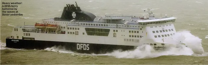  ??  ?? Heavy weather: A DFDS ferry battered by the waves at Dover yesterday
