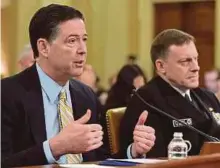  ?? AFP PIC ?? James Comey (left) and Mike Rogers at the House Permanent Select Committee on Intelligen­ce hearing on Capitol Hill, Washington, DC, yesterday.