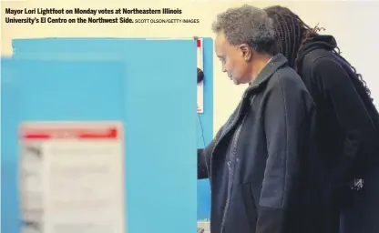  ?? SCOTT OLSON/GETTY IMAGES ?? Mayor Lori Lightfoot on Monday votes at Northeaste­rn Illinois University’s El Centro on the Northwest Side.