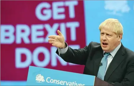  ?? OLI SCARFF/AFP ?? British Prime Minister Boris Johnson delivers his keynote speech to delegates on the final day of the annual Conservati­ve Party conference.