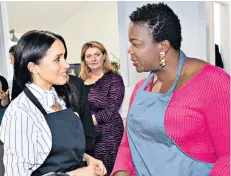  ??  ?? Meeting women: the Duchess at the Luminary Bakery in Camden yesterday, left, and joining Monica in the kitchen, above, with Bryony Gordon looking on