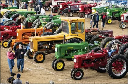  ?? THE ASSOCIATED PRESS ?? Visitors view antique tractors during the 2020 Farm Show in Harrisburg.