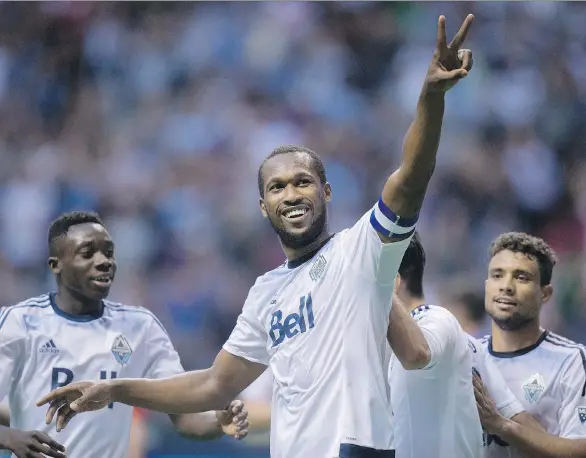  ?? DARRYL DYCK/ THE CANADIAN PRESS FILES ?? Vancouver Whitecaps defender Kendall Waston, centre, celebrates his goal against Crystal Palace as Alphonso Davies, left, and Kianz Froese, right, watch last July. Coach Carl Robinson will be returning to guide the Caps through its seventh MLS season...