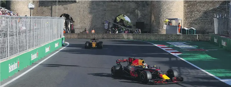  ?? — CLIVE ROSE/GETTY IMAGES ?? Daniel Ricciardo of Australia, driving the Red Bull Racing car, secures his fifth career win at the Azerbaijan Formula One GP on Sunday in Azerbaijan.