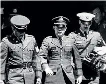  ??  ?? Flanked by two military policemen carrying his personal belongings, Lieutenant William L Calley Jr, of Miami, Florida, leaves court at Fort Benning, Georgia after he was sentenced to life imprisonme­nt for his role in the massacre at My Lai.