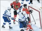  ?? DAVID BANKS/AP ?? Tampa Bay Lightning left wing Pat Maroon (14) celebrates his goal against the Chicago Blackhawks during the third period on Sunday.