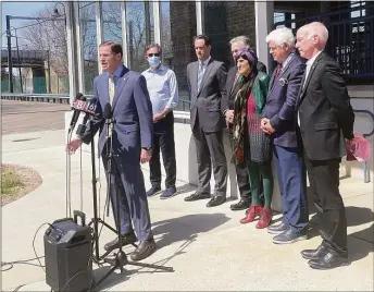  ?? Abigail Brone / Hearst Connecticu­t Media ?? U.S. Sen. Richard Blumenthal, at microphone, joins Gov. Ned Lamont and U.S. Reps. John Larson, Joe Courtney, Rosa DeLauro and Jim Himes, as well as Transporta­tion Commission­er Joe Giulietti, at the Guilford train station on Wednesday. The group discussed the $250 million the state will receive in each of the next five years from the federal infrastruc­ture bill passed last year.