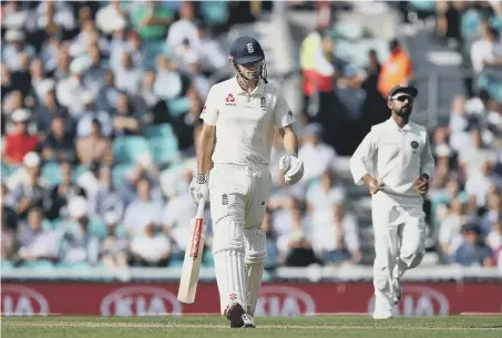  ??  ?? Alastair Cook walks from the field after being bowled out.