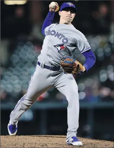  ?? PATRICK MCDERMOTT/GETTY IMAGES ?? Blue Jays starting pitcher Aaron Sanchez throws a pitch against the Orioles during the third inning in Baltimore last night. Sanchez pitched eight innings, giving up a run to earn the win.