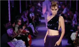  ??  ?? Models including Gigi Hadid wore bras and tops made to look like breastplat­es – or solidified, lacquered nail polish moulded to skin. Photograph: WWD/Rex/Shuttersto­ck